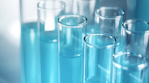 Clear Liquid Added to Lab Test Tubes