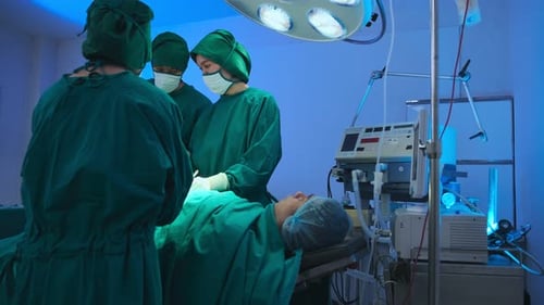 Surgeons Perform Operation in Brightly Lit Operating Room
