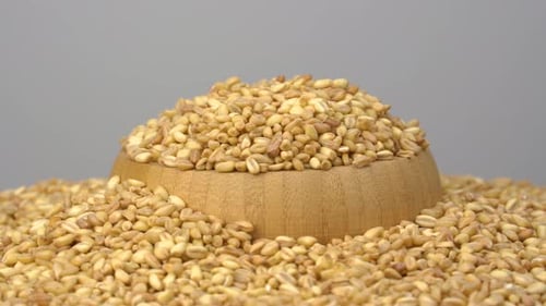 Wooden Bowl Filled with Golden Grains
