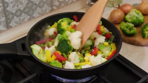 Fresh Vegetables Stir-Fried in a Pan on Stove