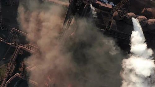 Aerial View of Steel Factory Releasing Smoke