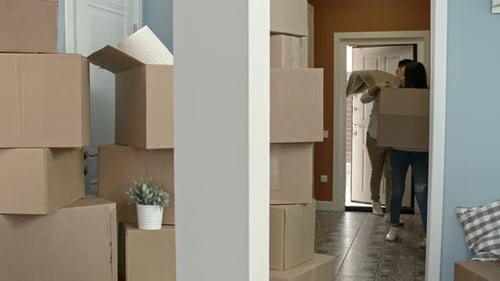 Couple Moving Possessions to New House