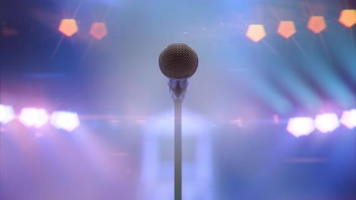 Microphone and Colorful Spotlights Moving with the Rhythm of the Music and Sound