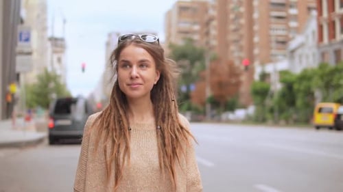 Young Woman Going Along the Street