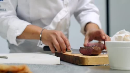 Chef Cuts Tender Beef Steak in Kitchen