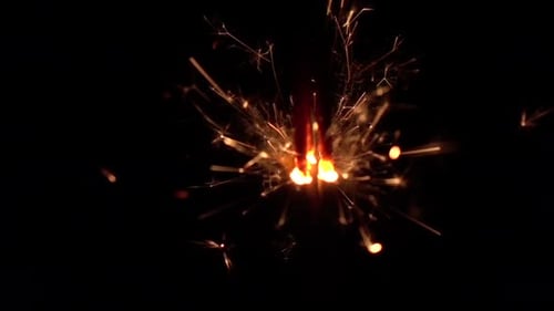 Sparkling Sparkler Emitting Bright Light on Black