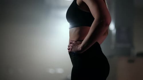 Fit Woman Poses in Gym