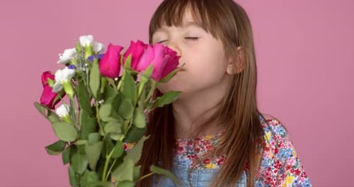 Cute Girl Smelling Fresh Roses Bouquet for Birthday