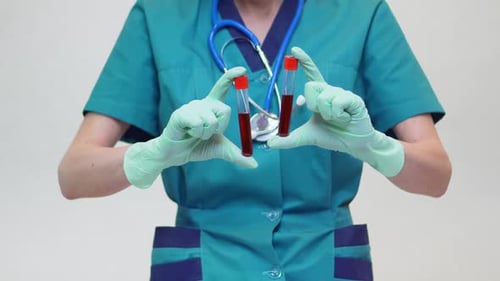 Medical Professional Holding Blood Sample Vials