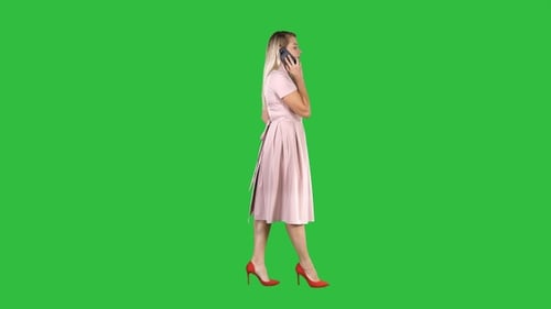pink dress green screen Pink Dress Hanging On Folding Screen On A Green Background Stock Photo - Download Image Now