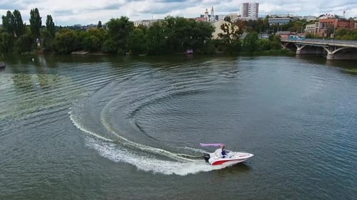 Boat sailing on river. Aerial view of ship floating the river