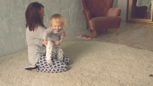 Cute little girl run and hugs her mother