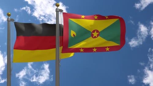 Germany and Grenada Flags Waving Together in Blue Sky