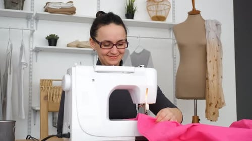 Smiling Tailor Enjoying Work at Modern Atelier