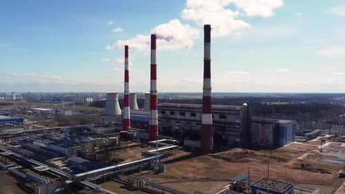 Timelapse aerial view of a working soaring heat power station at an industrial zone