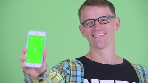Man Holding Phone with Green Screen Close Up