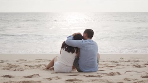 Young Lovers on Honeymoon Hugging at Beautiful Sea Beach