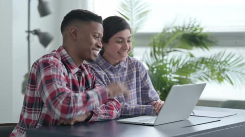 Cheerful Young Adults on Video Call At Home