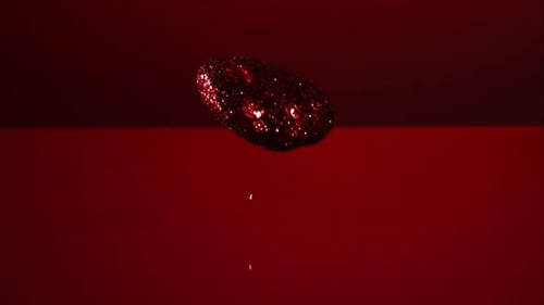 Decorations falling, bouncing in ultra slow mo 1500fps - reflective surface - VALENTINES PHANTOM 004