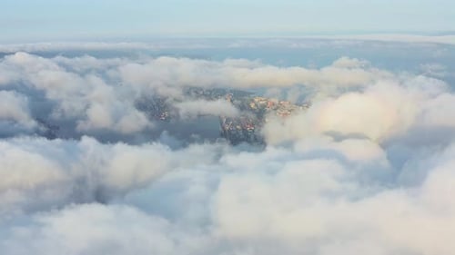 An Epic View Through the Clouds of the City at Dawn