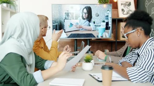 Team in Video Conference Meeting in Modern Office