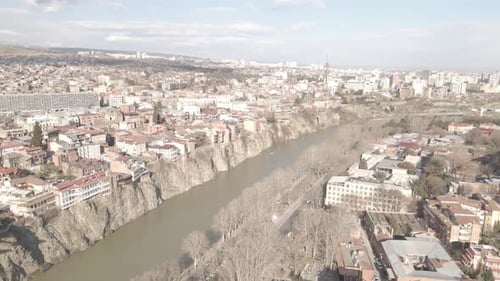 Aerial view of Metekhi church in old Tbilisi located on cliff near river Kura. Georgia 2021 Spring