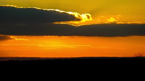 Timelapse Sunset in the Sky Big Bright Yellow Sun Moves Down on the Horizon