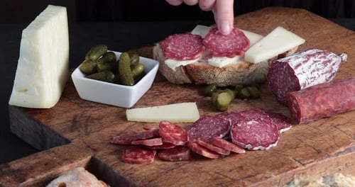 Preparing an Appetizer with Cheese and Salami