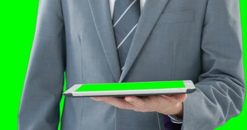 Tablet Green Screen Used by Suited Person