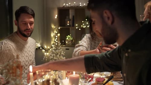 Friends Gather for a Cozy Candlelit Dinner