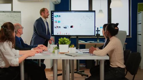 Business Team Collaboration Presentation in Modern Office