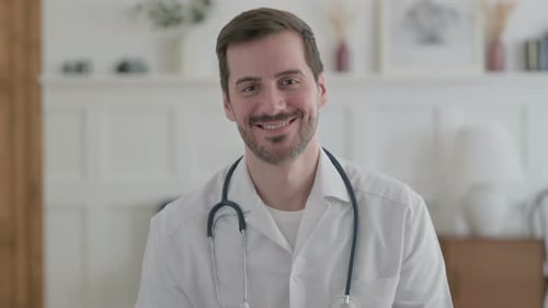 Smiling Doctor Wearing Stethoscope in a Medical Clinic