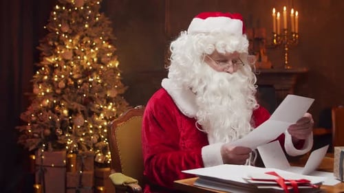 Santa Claus Reads Letters by Christmas Tree