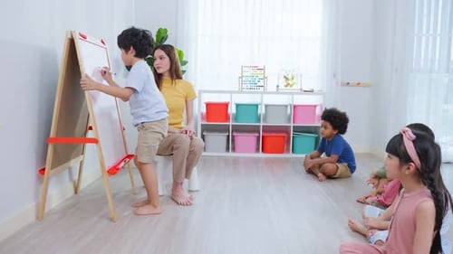 Asian beautiful young woman teacher teaching a lesson to kid at school.