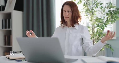Woman Meditating at Desk for Wellness Break