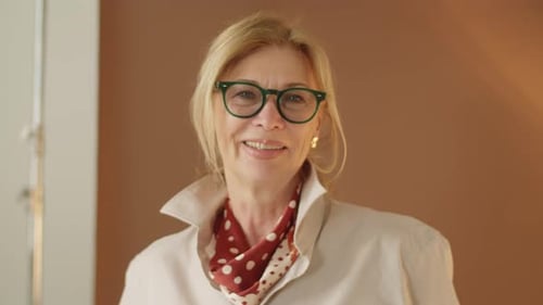 Portrait of Beautiful Senior Woman Smiling at Camera
