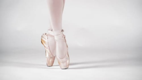 Ballet Dancer Feet in Pointe Shoes Rotating