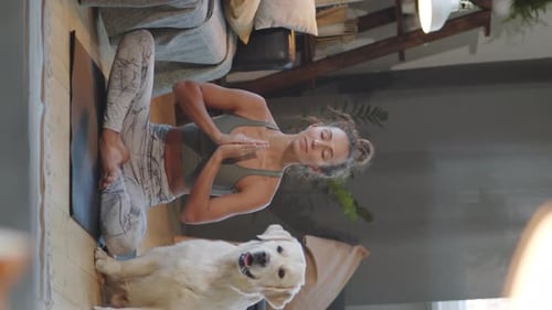 Woman Doing Yoga with Dog