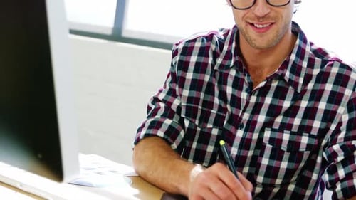 Man Using Digital Tablet at Office Desk
