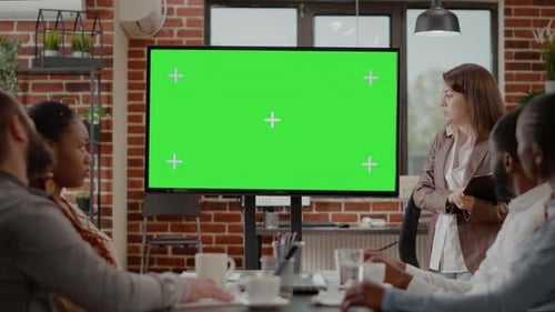 Diverse Business People Looking at Green Screen on Monitor Display