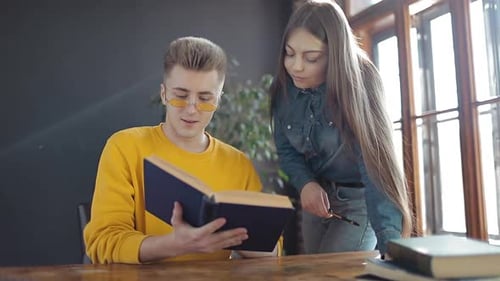 Young Adults Studying Together Indoors During Daytime