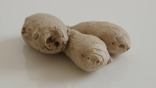 Healthy Zingiber officinale rhizome 4K 2160p 30fps UltraHD tilting footage - Pieces of ginger root o