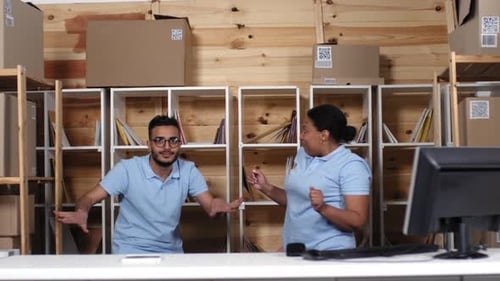 Employees Celebrating Success Together in Office Setting