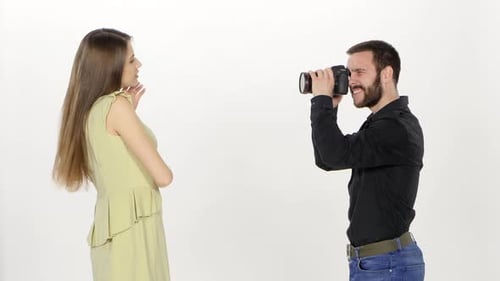 Shooting in the Studio. Model and Photographer. White