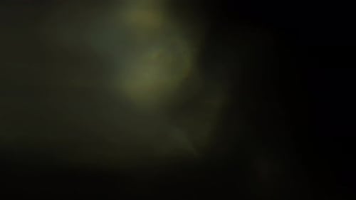Abstract Light Leaks Shimmering on Black Background