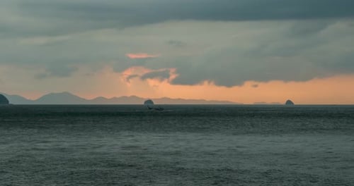 Time-lapse of Light Rays Over the Sea or Ocean at Sunset