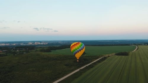 Hot Air Balloon in the Sky Over a Field