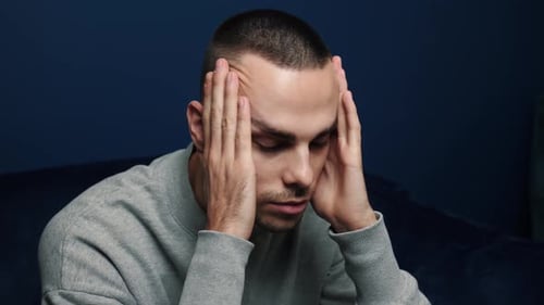 Depressed Desperate Man Feeling Worried . Stressed Businessman Looking Frustrated Sitting at Home
