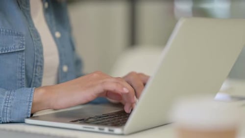 Side View of Hand of African Woman Typing on Laptop