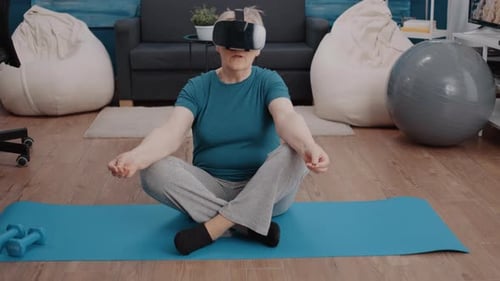 Woman Wearing VR Headset Meditating on Yoga Mat